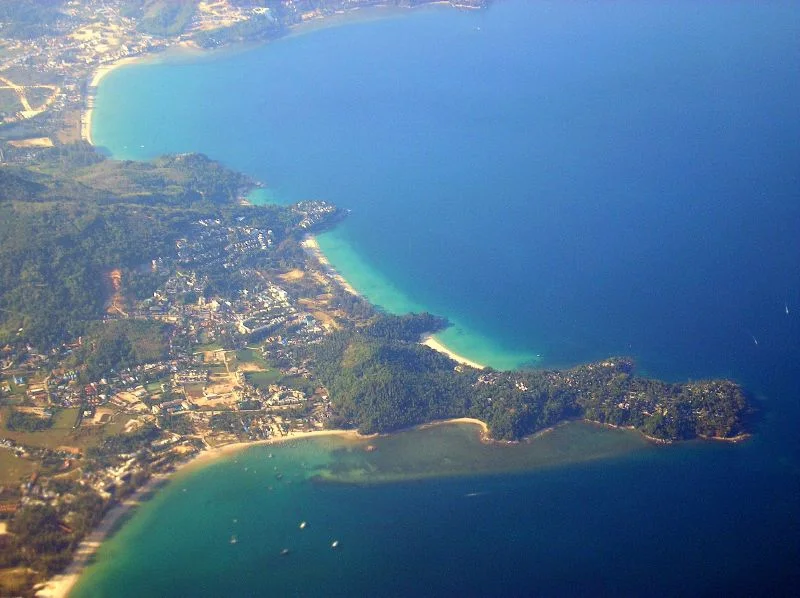 Bang Tao bay from the air: Pansea, Surin and Kamala capes in the distance