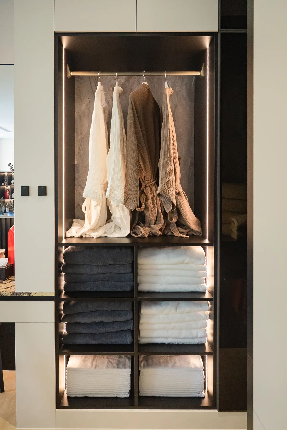 Walk-in closet with backlit shelving