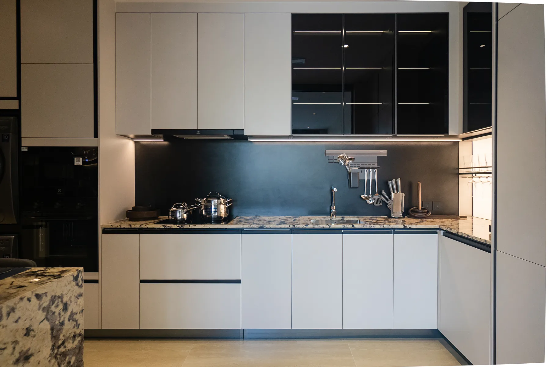 Kitchen with stone worktop and bar